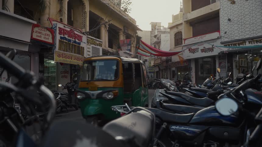 Traffic on a small street and in an alley of an underveloped urban neighborhood outdoors during day time