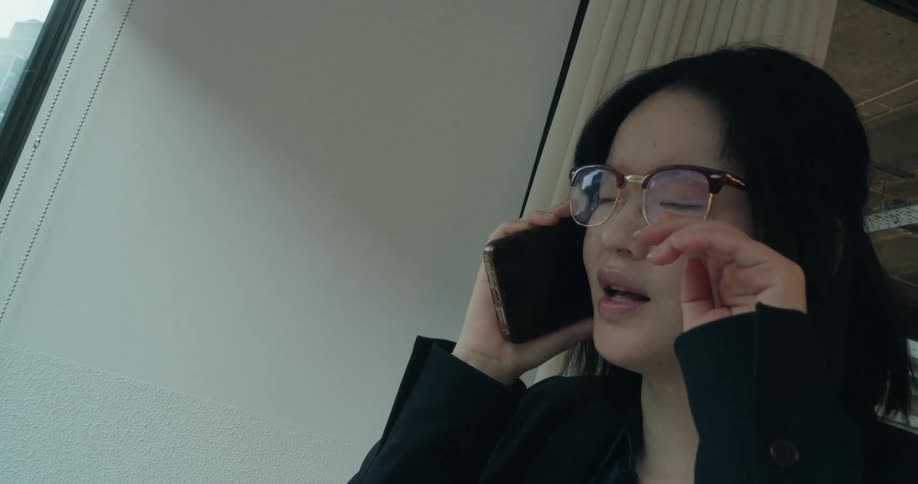 A woman talking on a smartphone