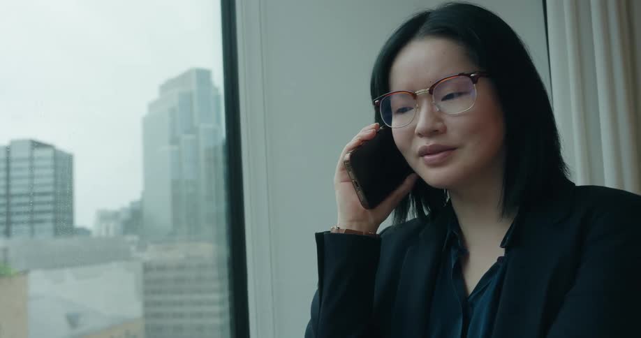 A woman talking on a smartphone