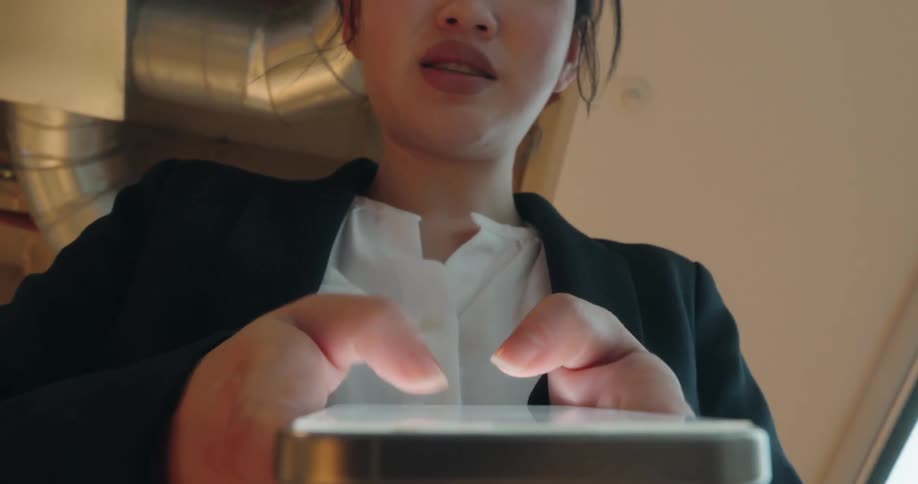 Woman typing on her smartphone