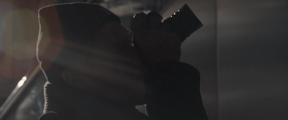 A man takes photographs in a dark area