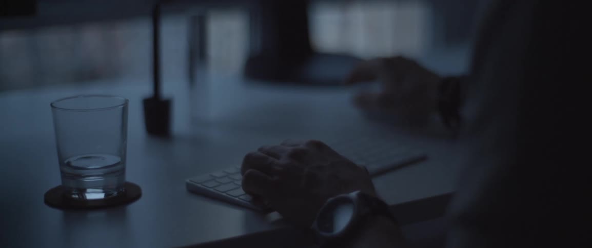 A man is typing on a keyboard
