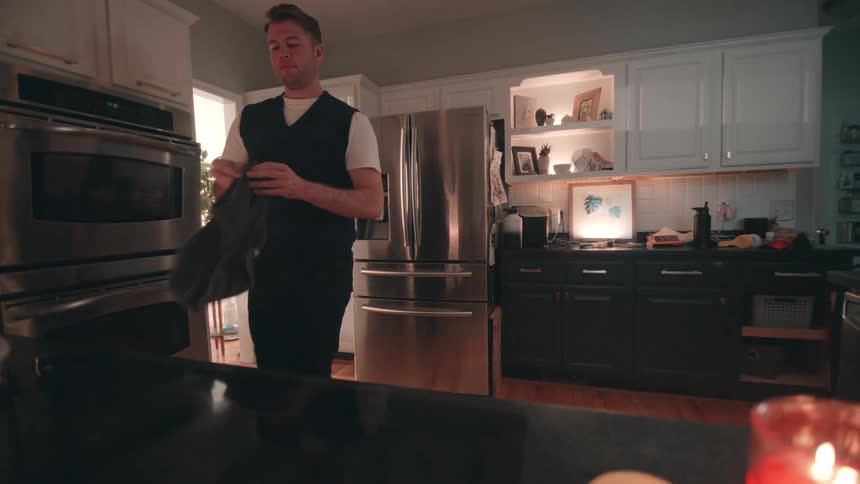 Man wiping down the kitchen counter
