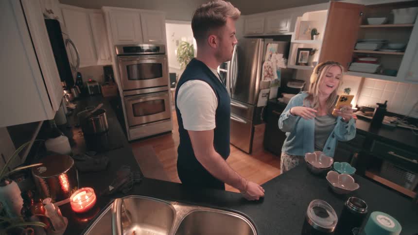 Couple organizing items in the kitchen