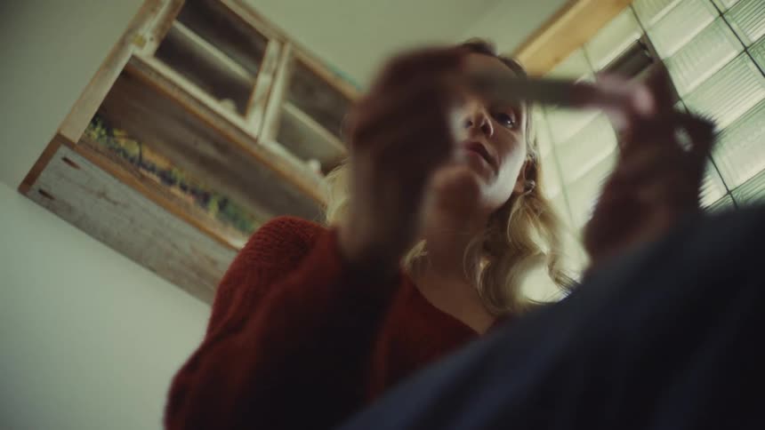 A woman checking a pregnancy test