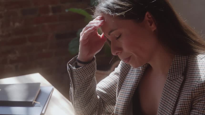 A woman that is frustrated working in an office