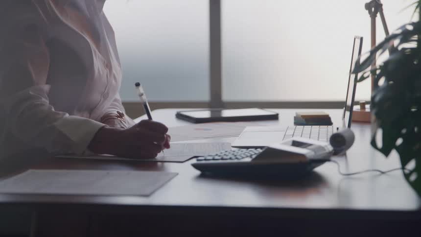 A woman working at a desk in an office