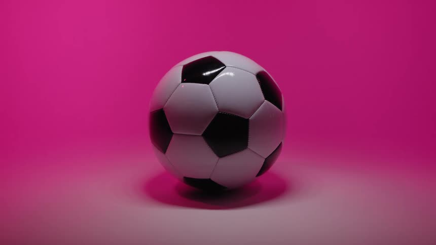 A soccer ball against a colorful background