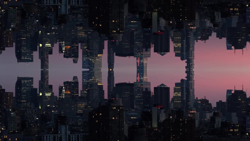 A surreal mirrored view of an illuminated city skyline at twilight with a gap between the buildings showing a reddish purple sky
