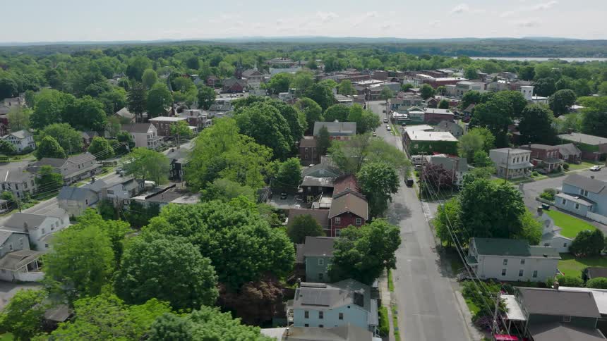 Subtle descent over an older neighborhood of working class homes in a small town