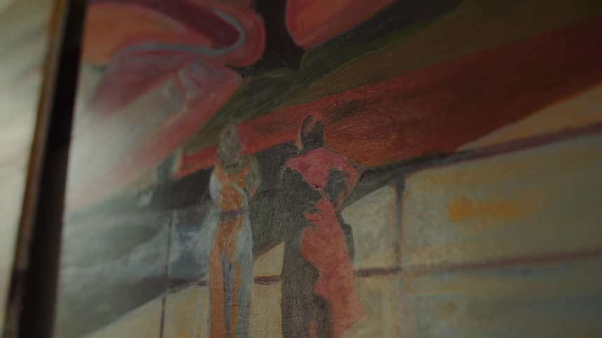 Painted artwork with stylized human figures in abstract urban setting featuring intense and contrasting tones