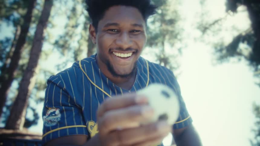 Player holding a mini soccer ball