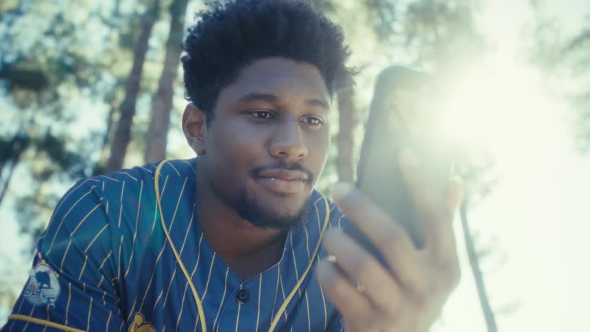 A man using a smartphone outdoors
