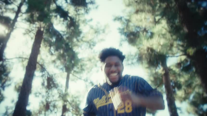 A man running out in a forest