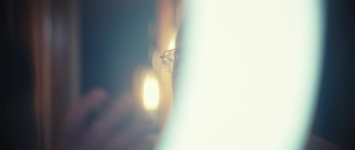 A man looking at a ring light
