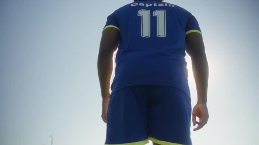 A man getting ready to kick a soccer ball