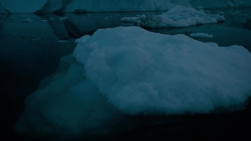 Melting ice floating across arctic water
