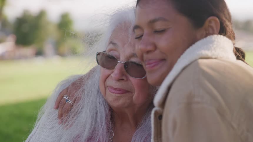 A woman hugging another woman