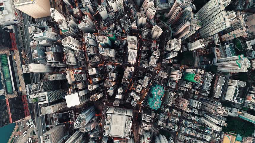 An aerial view of a city full of tall skyline buildings