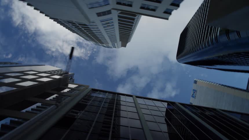 Looking up at towering skyscrapers