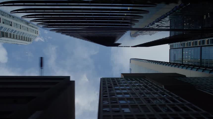 View looking up at tall downtown towers and skyscrapers