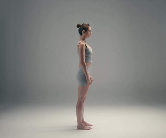 A woman adjusting her posture