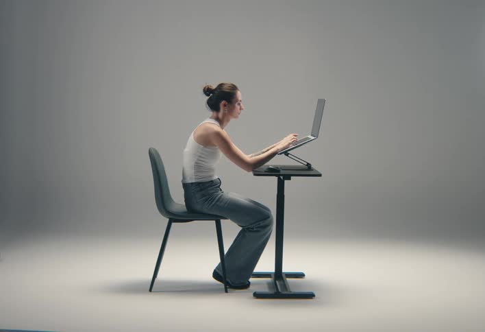 Woman typing on a laptop