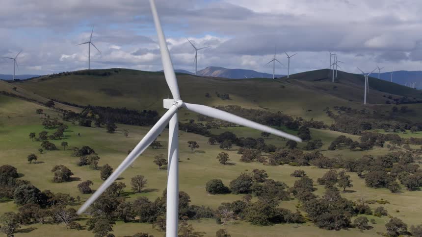 Wind turbines rotate in the wind