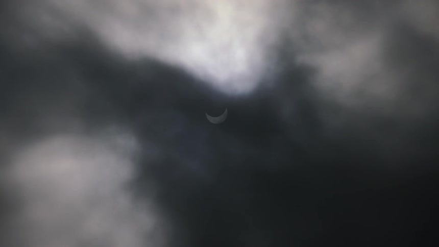 Solar eclipse as clouds move in front
