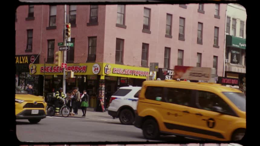 Traffic and people on a downtown street on a metropolitan area outdoors during day time