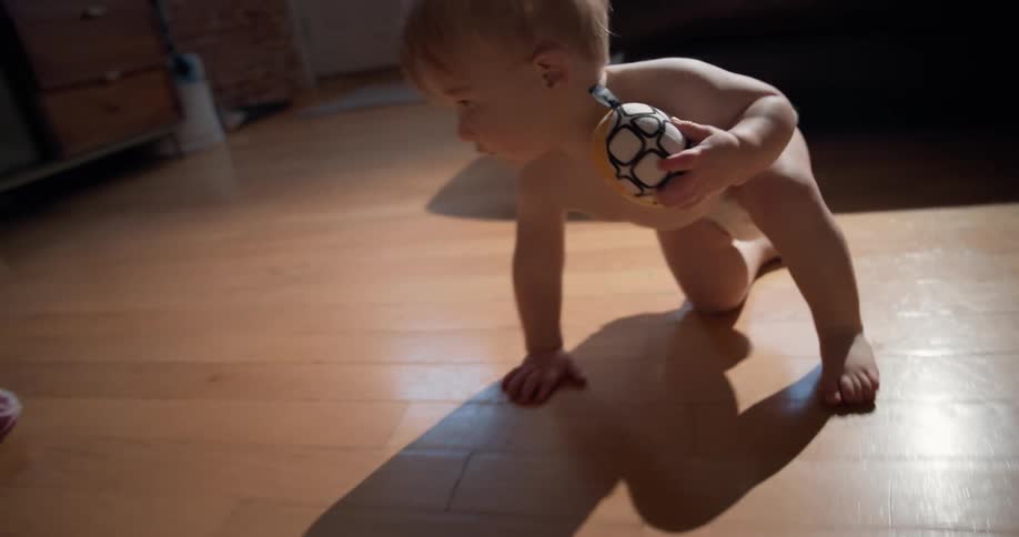 A baby crawling on the ground
