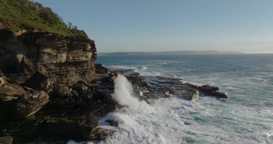 Waves crash along the coast