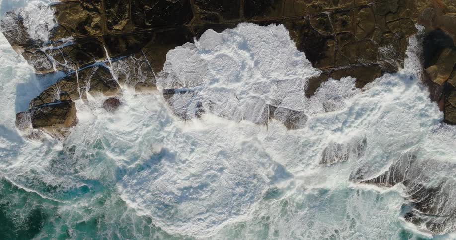 Large waves move over the beach