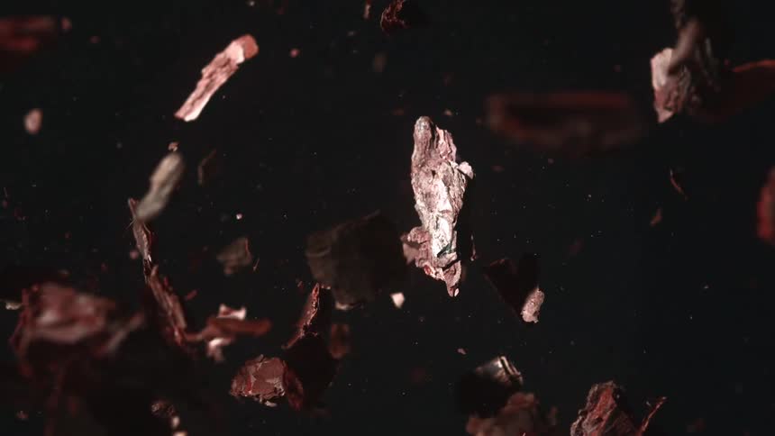 A brown object shattering