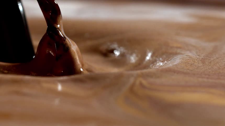 Dark color is splashed into the brown paint