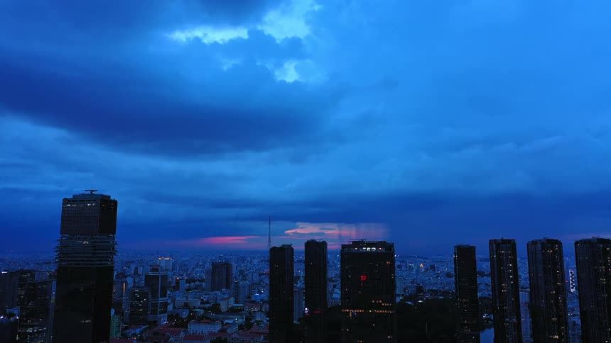 Heavy white clouds are over the city