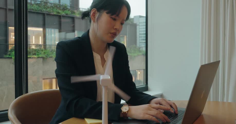 Woman typing on a laptop