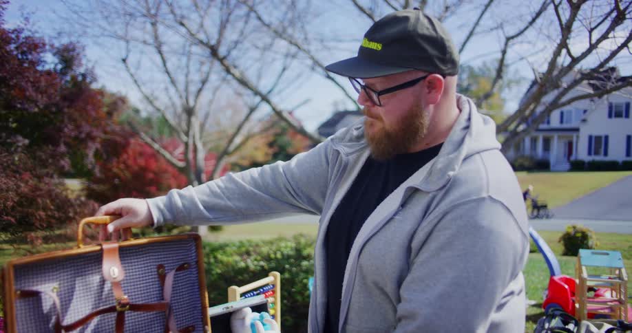 People look at items on an outdoor table