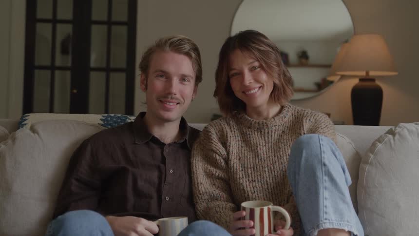 A man and woman sitting on a couch