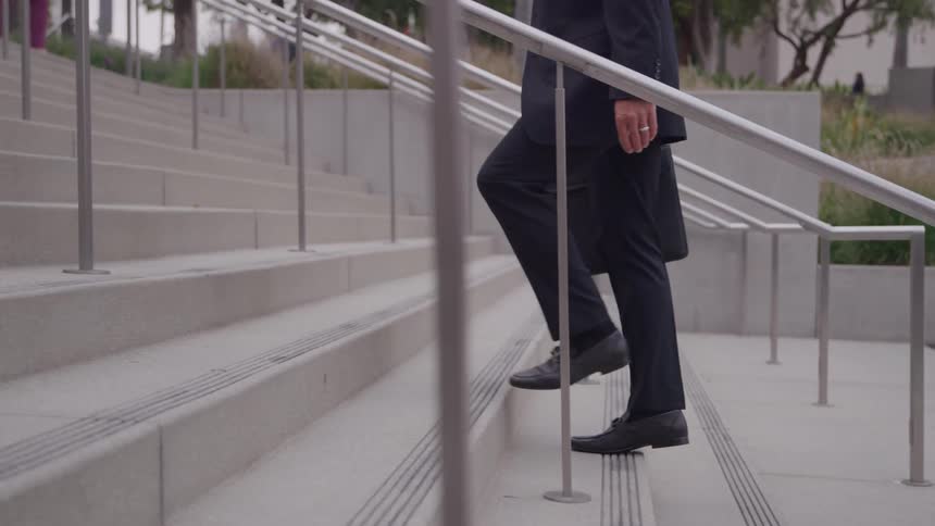 A person walking up some stairs