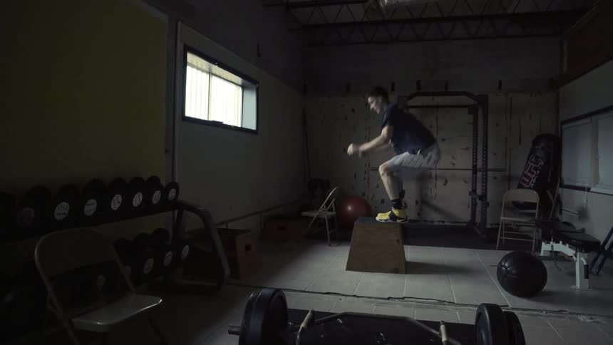 Man jumping up and down on a high step