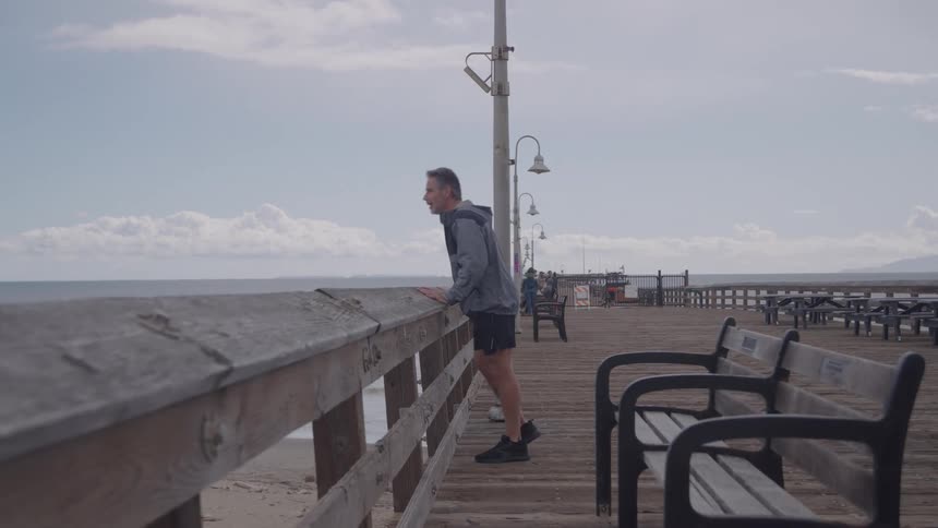 A man running on a pier