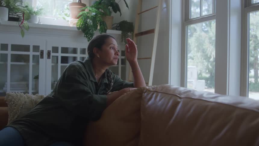 A woman looking out a window