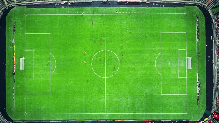 The fans watch a soccer game at the stadium