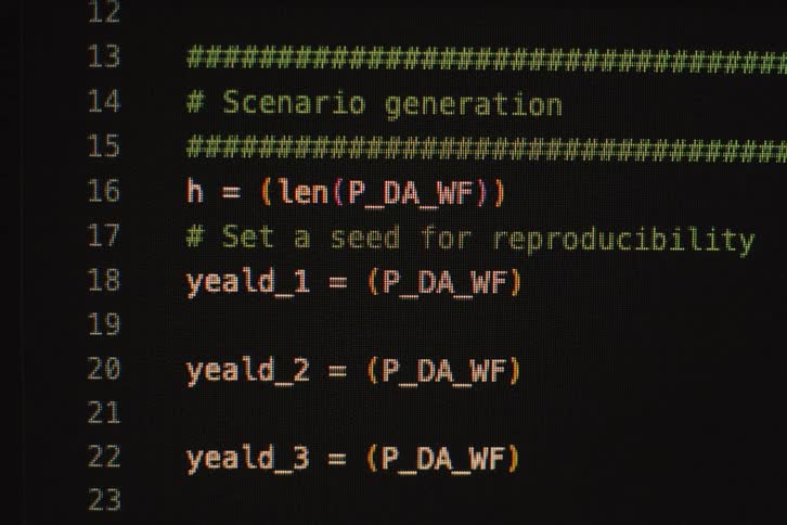 A black screen with colored programming codes being written