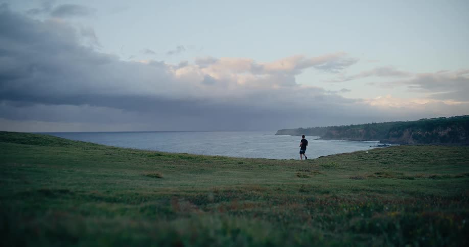 The man runs towards the shore
