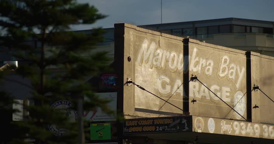 A billboard is out front of the building