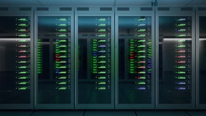 Row of server racks with multiple green and red indicators visible through glass doors