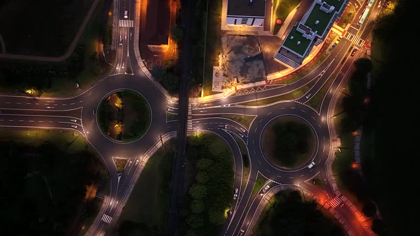 Intersection with two roundabouts illuminated at night