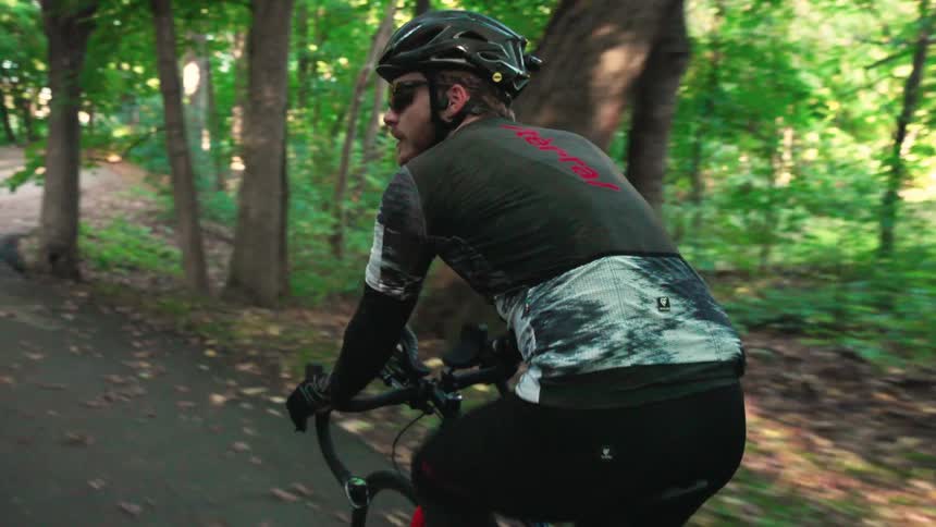 A person riding a bicycle down a trail